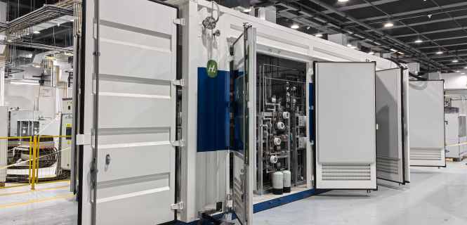 Delivered containerized skid-mounted PEM hydrogen production system